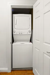 a view of hallway with wooden floor