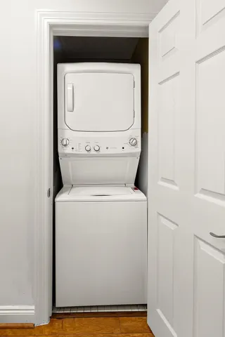 a view of hallway with wooden floor
