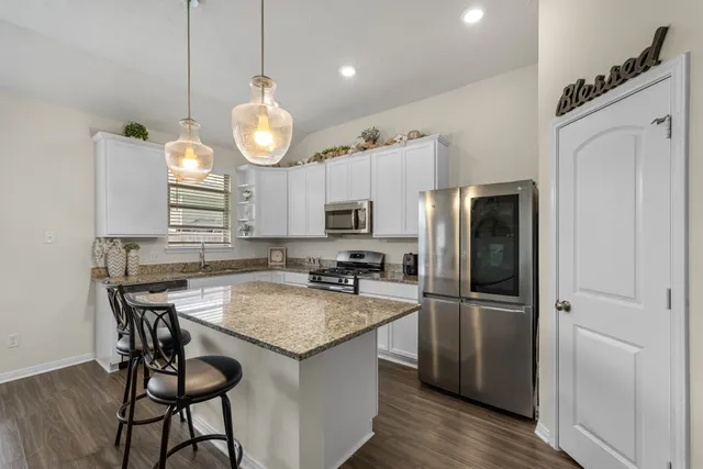 a kitchen with a refrigerator a sink and a refrigerator