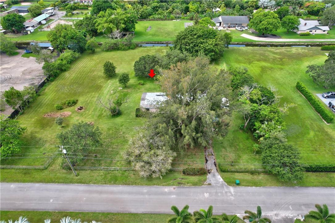 17700 Southwest 68th Court Southwest Ranches, FL 33331 - Photo 1 of 23 a view of a garden with a lake