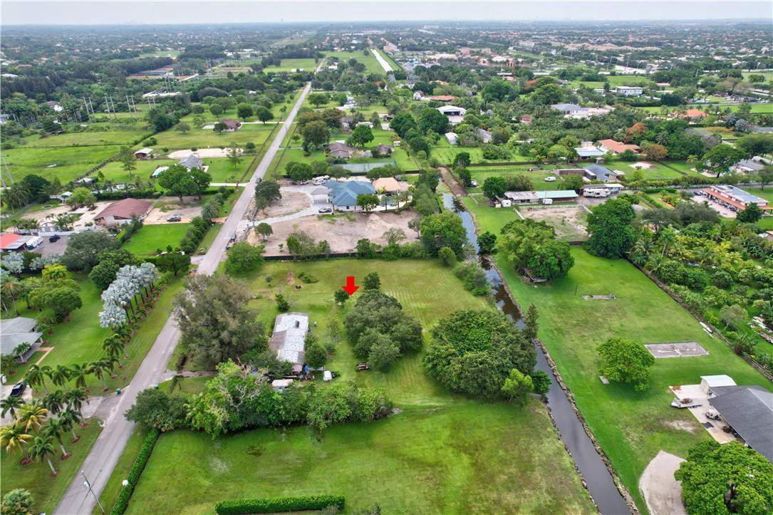 17700 Southwest 68th Court Southwest Ranches, FL 33331 - Photo 12 of 23 an aerial view of residential houses with outdoor space and trees