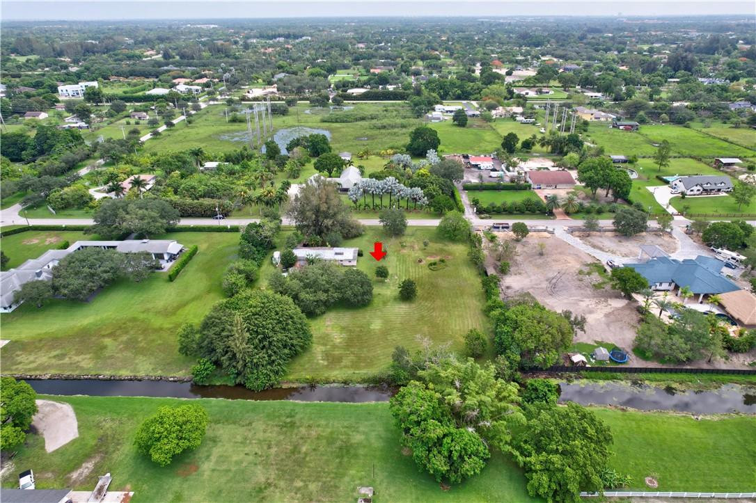 17700 Southwest 68th Court Southwest Ranches, FL 33331 - Photo 13 of 23 an aerial view of residential houses with outdoor space and trees