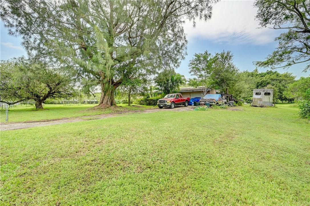 17700 Southwest 68th Court Southwest Ranches, FL 33331 - Photo 14 of 23 a view of yard with trees and grass