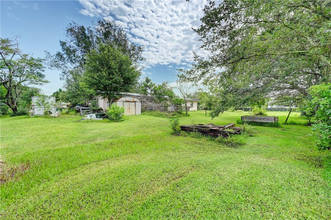 17700 Southwest 68th Court Southwest Ranches, FL 33331 - Photo 19 of 23 a view of backyard with a table and chairs