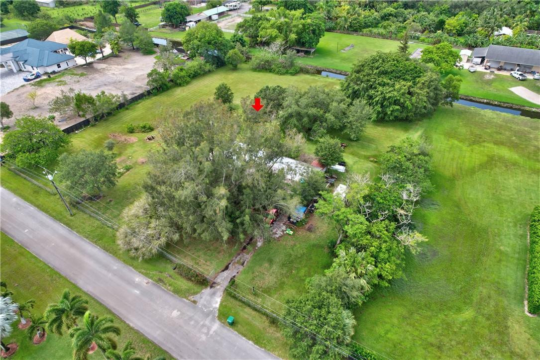 17700 Southwest 68th Court Southwest Ranches, FL 33331 - Photo 2 of 23 a view of a garden with a tree