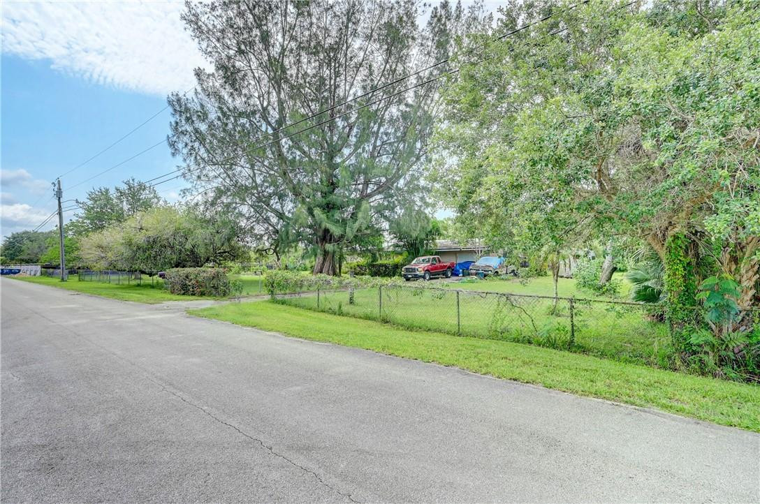 17700 Southwest 68th Court Southwest Ranches, FL 33331 - Photo 22 of 23 a green field with lots of trees in the background