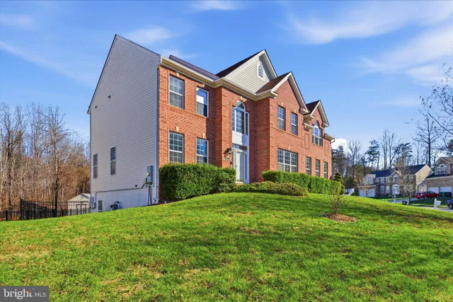 a front view of a building with a yard