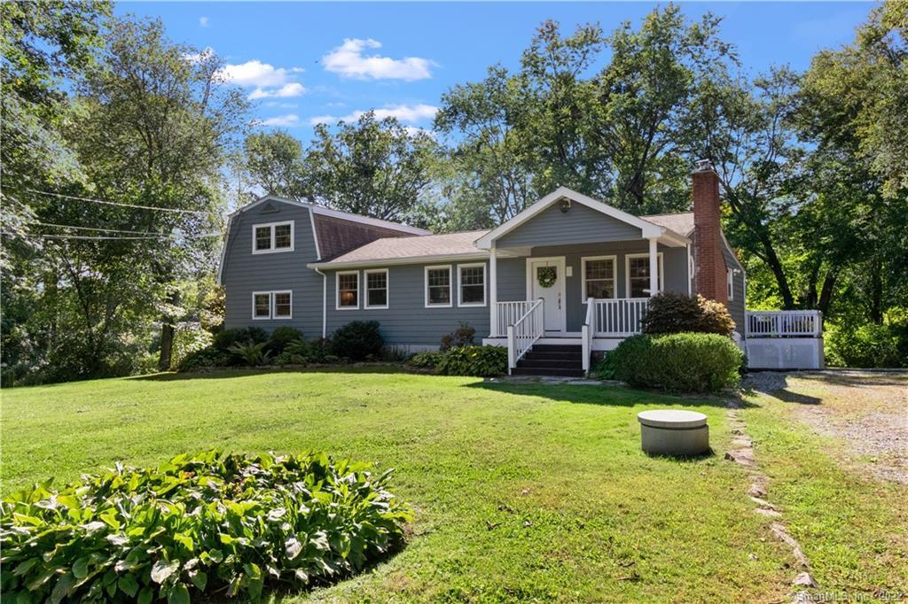 341 Farmholme Road Stonington, CT 06378 - Photo 1 of 1 a front view of a house with a yard and garage