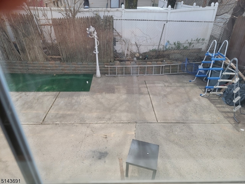 232 Amity Street, Unit 1 Elizabeth, NJ 07202 - Photo 6 of 11 a view of a patio with a table and chairs
