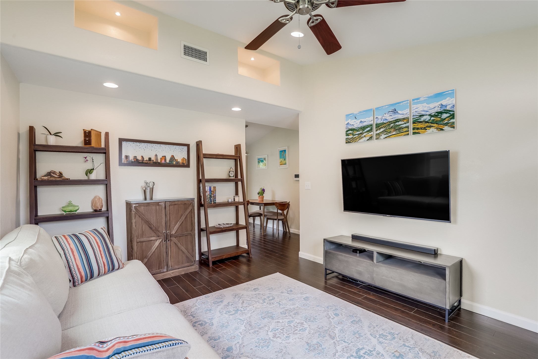 5112 Heflin Lane Austin, TX 78721 - Photo 11 of 38 The bright and spacious living room flows seamlessly into the eat in kitchen, providing a desirable separation of spaces while also making it easy to stay connected.