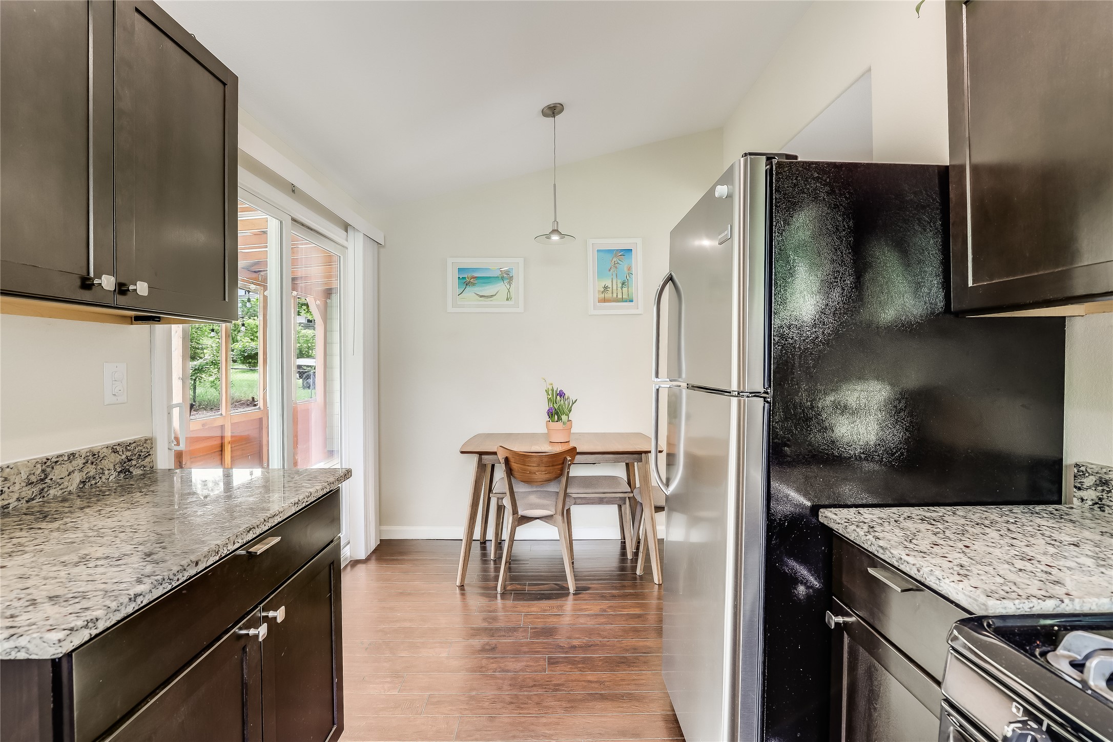 5112 Heflin Lane Austin, TX 78721 - Photo 14 of 38 The kitchen also offers space for a dining table under a pendant chandelier.