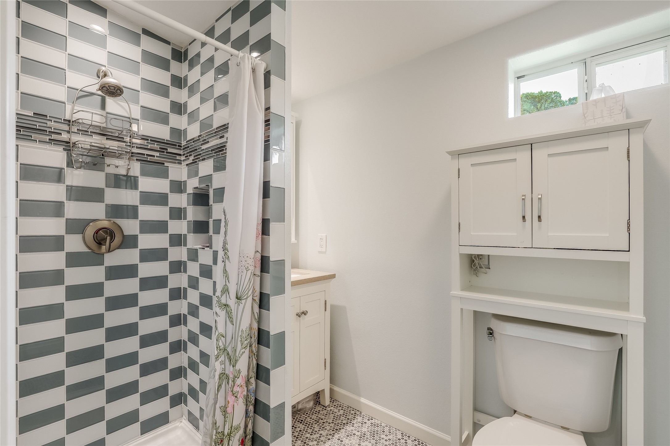 5112 Heflin Lane Austin, TX 78721 - Photo 20 of 38 There's also a gorgeous walk-in shower with chic tile backsplash.