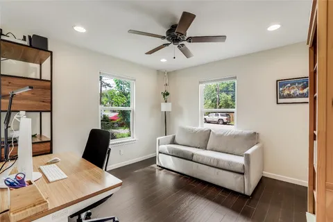 a living room with furniture and a window