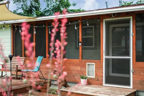 a view of a front of a house with a yard