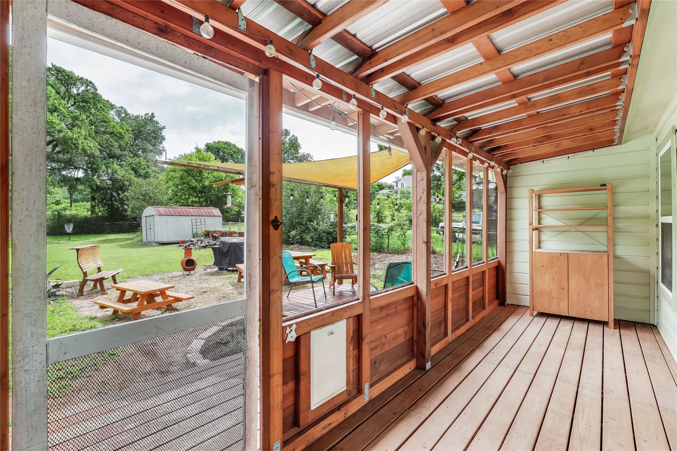 5112 Heflin Lane Austin, TX 78721 - Photo 5 of 38 There's even a beauitful screened in deck with al fresco extension and a huge fenced-in yard.