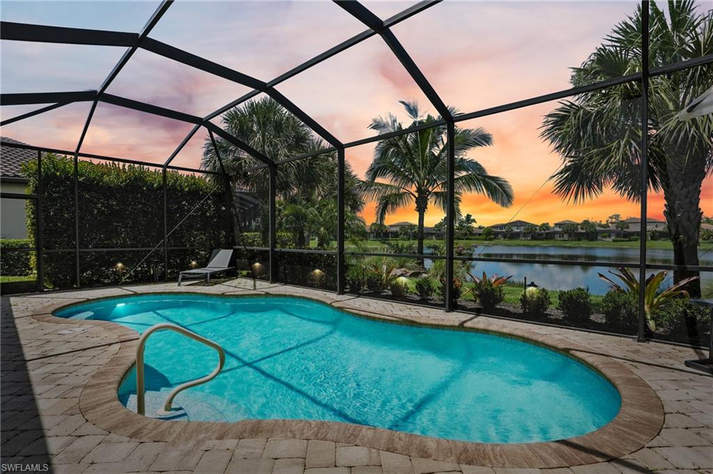 4649 Abaca Circle Naples, FL 34119 - Photo 5 of 32 a view of swimming pool from a lounge chair