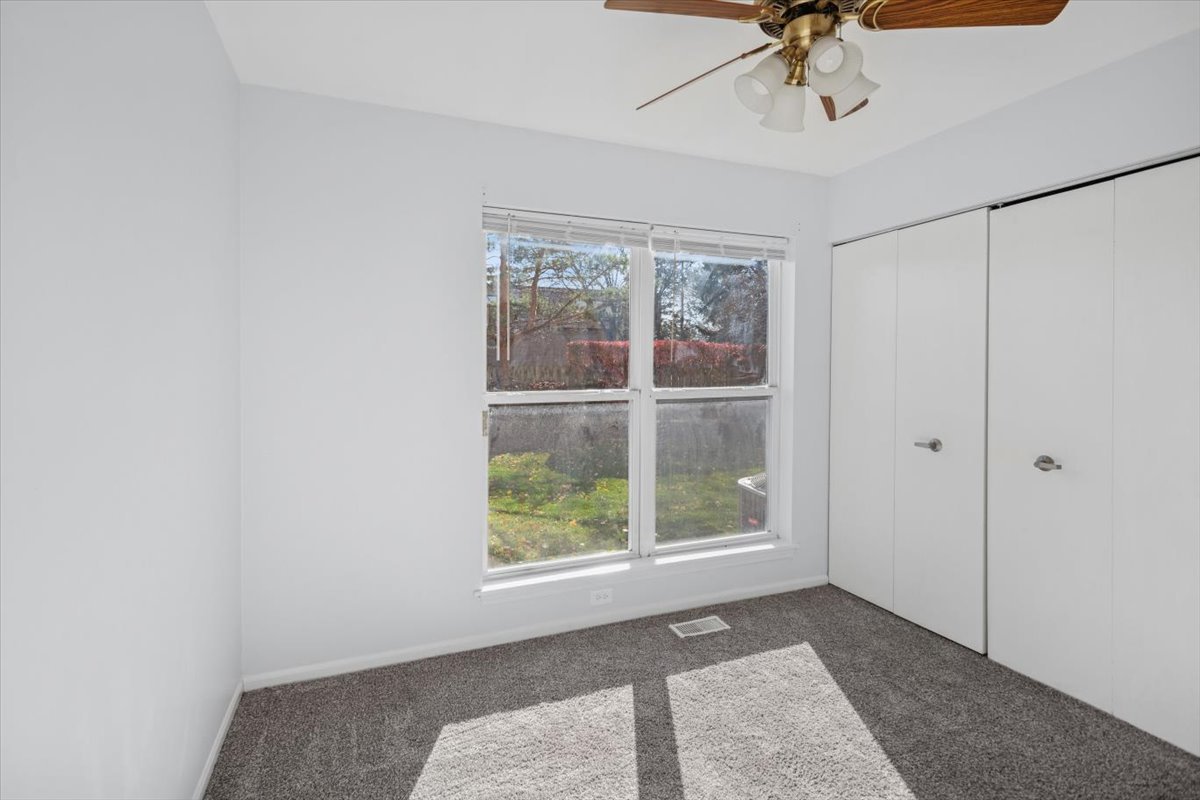 120 Cathy Lane, Unit 120 Mount Prospect, IL 60056 - Photo 11 of 20 a view of an empty room with a window