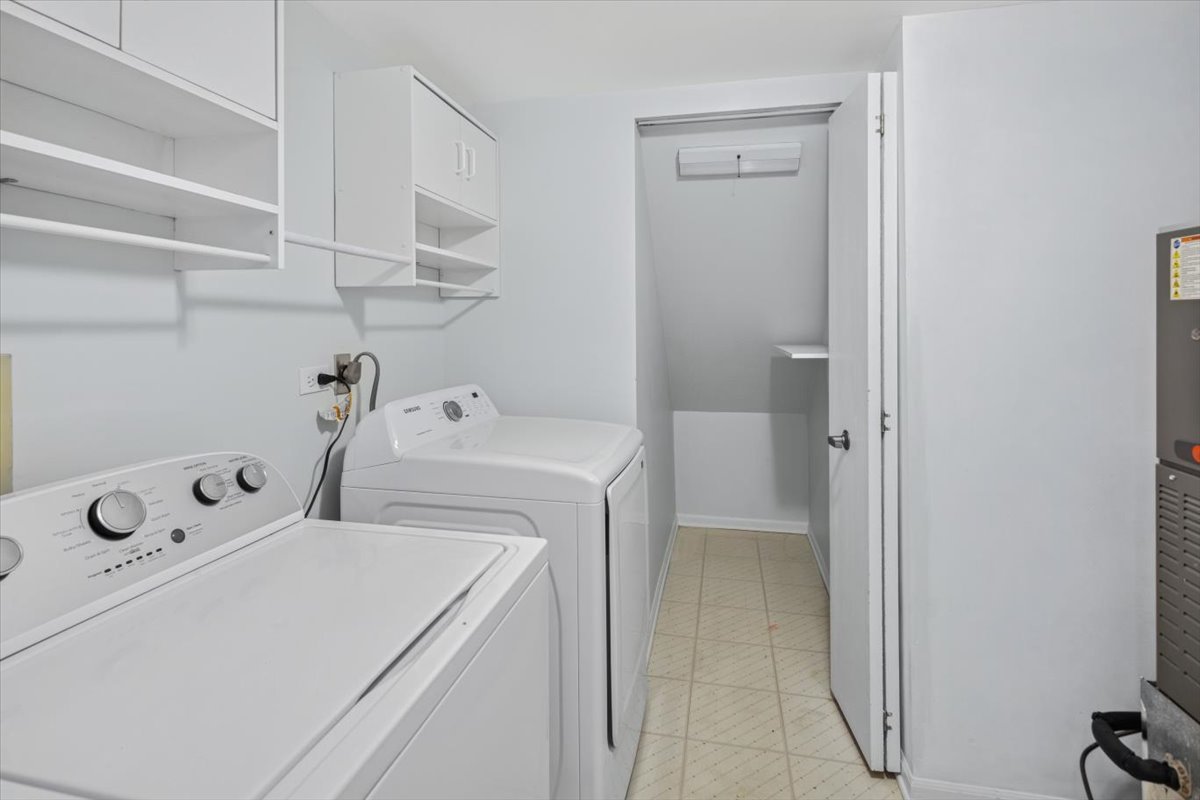 120 Cathy Lane, Unit 120 Mount Prospect, IL 60056 - Photo 17 of 20 a utility room with dryer and washer
