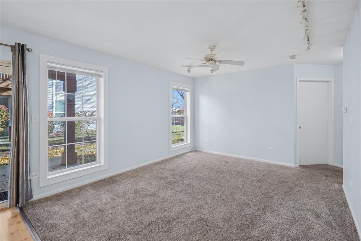 120 Cathy Lane, Unit 120 Mount Prospect, IL 60056 - Photo 4 of 20 a view of an empty room with a window