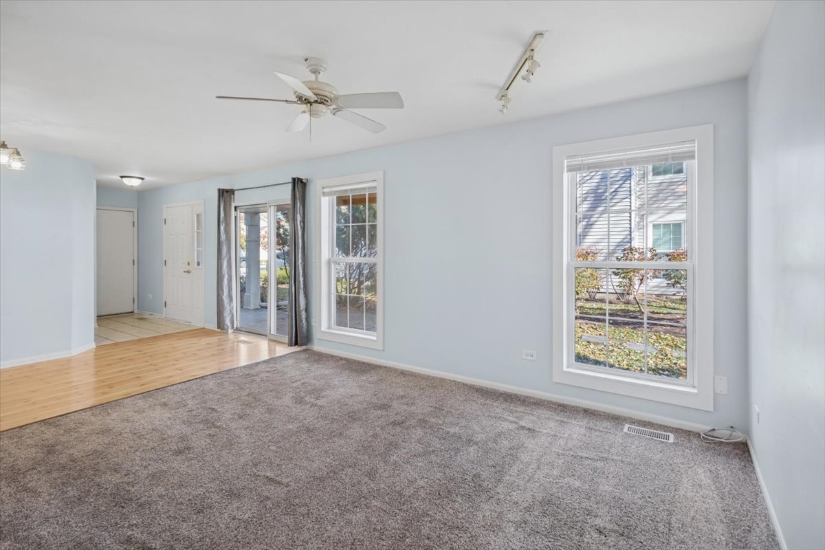 120 Cathy Lane, Unit 120 Mount Prospect, IL 60056 - Photo 5 of 20 a view of an empty room with a window