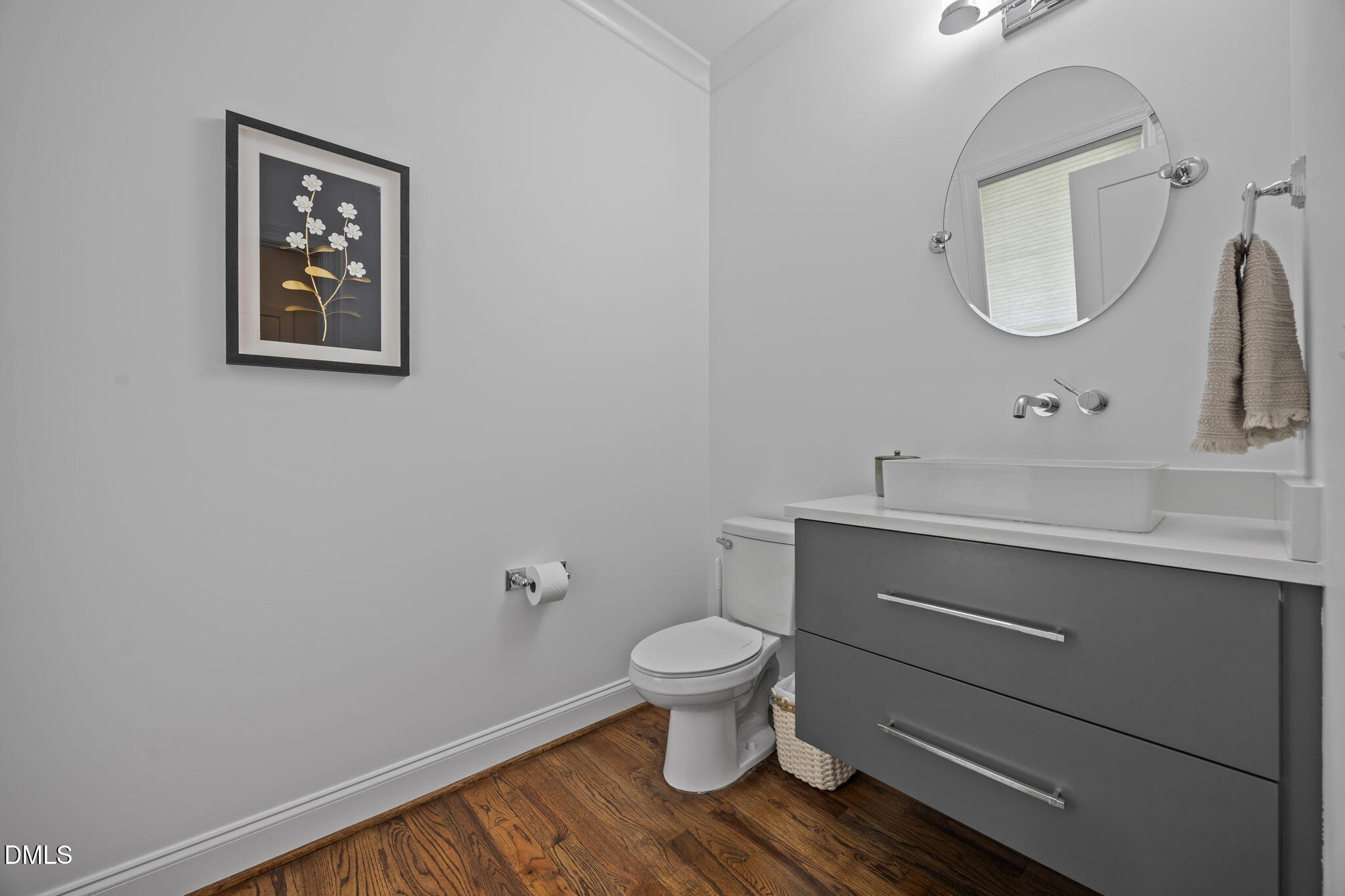 804 Hartford Road Raleigh, NC 27610 - Photo 16 of 26 a bathroom with a toilet sink and mirror
