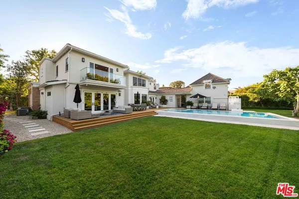 a view of a house with a yard porch and sitting area