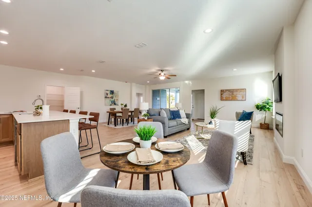 a view of a dining room with furniture window and wooden floor