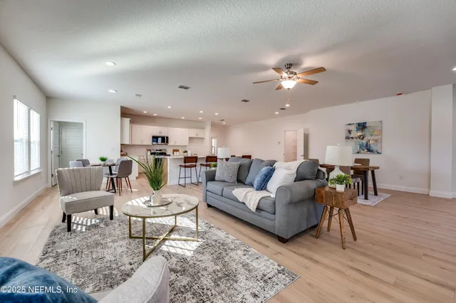 a spacious bathroom with a double vanity sink mirror double and shower