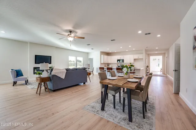 a en suite bathroom with a double vanity sink and a mirror