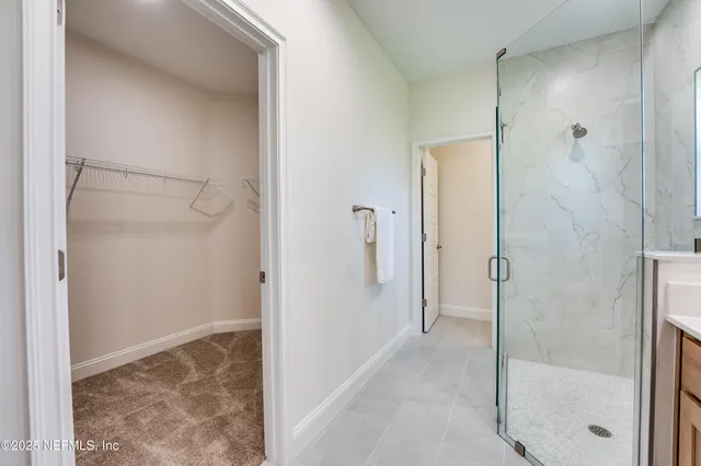 a bathroom with a toilet sink and a mirror