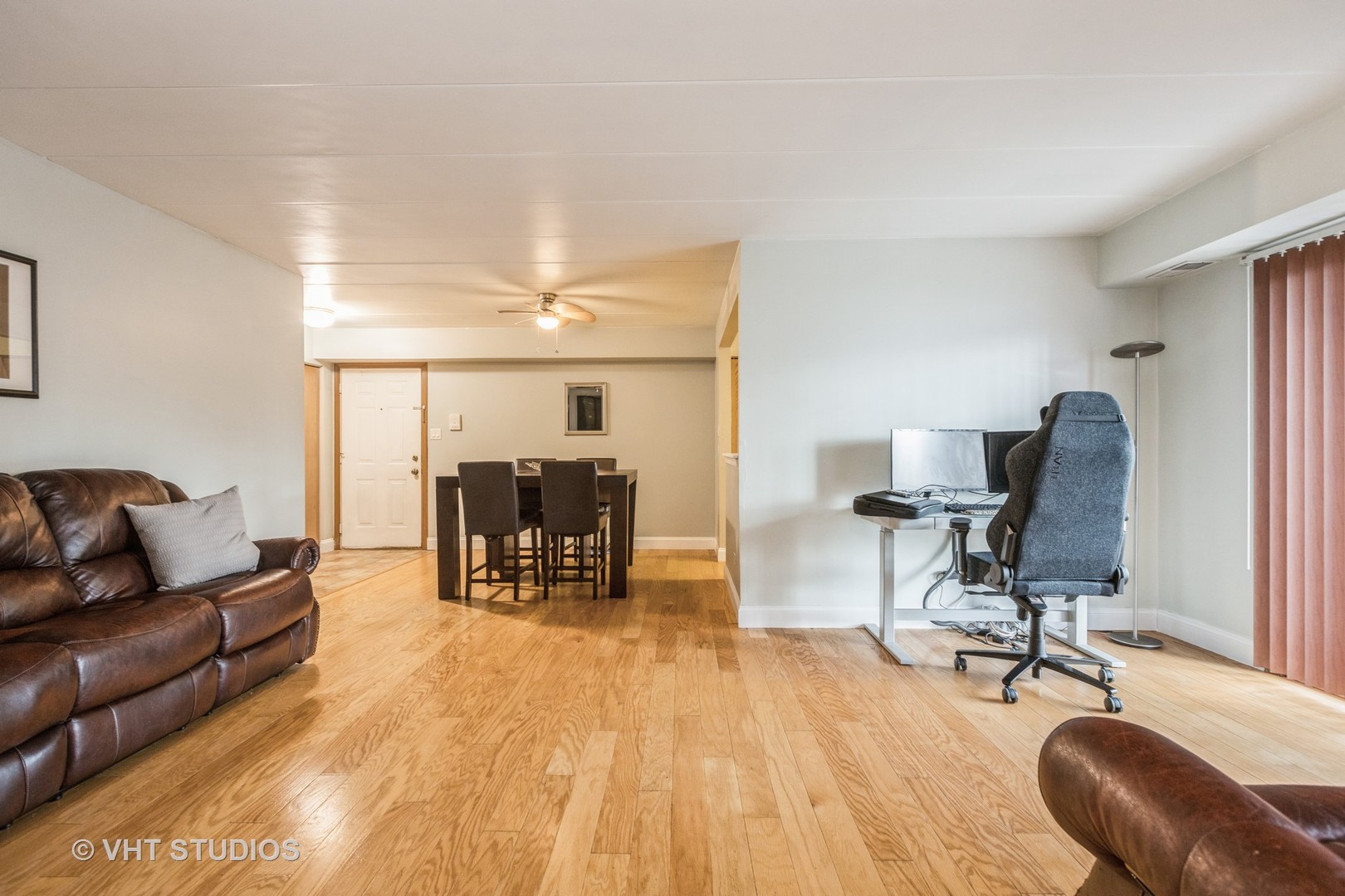 10288 SW Highway, Unit 1D Chicago Ridge, IL 60415 - Photo 4 of 12 a workspace with furniture and wooden floor