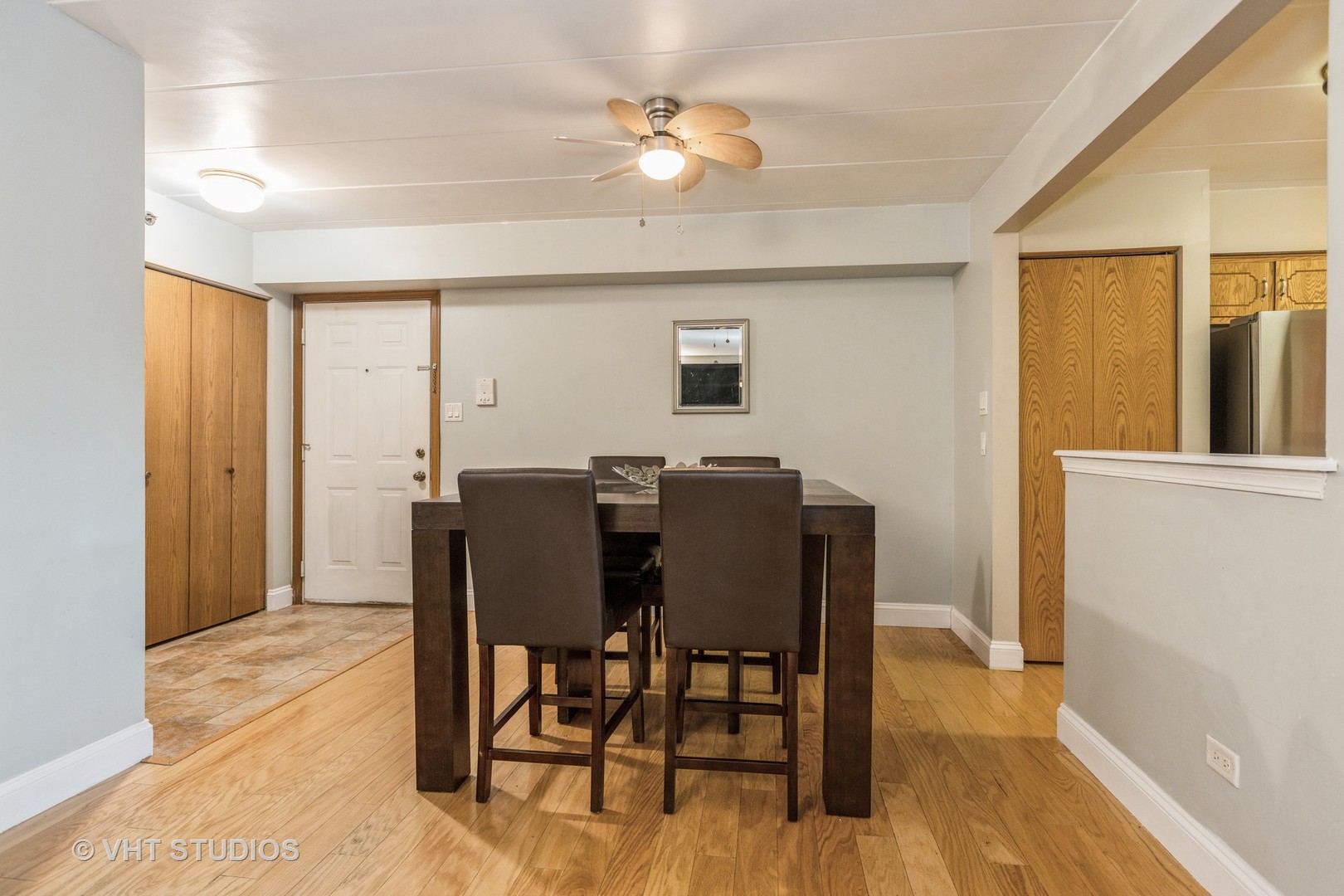 10288 SW Highway, Unit 1D Chicago Ridge, IL 60415 - Photo 5 of 12 a view of a dining room with furniture and a chandelier