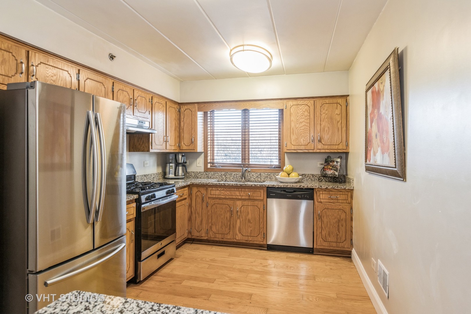 10288 SW Highway, Unit 1D Chicago Ridge, IL 60415 - Photo 6 of 12 a kitchen with stainless steel appliances granite countertop a refrigerator a stove a sink and a window