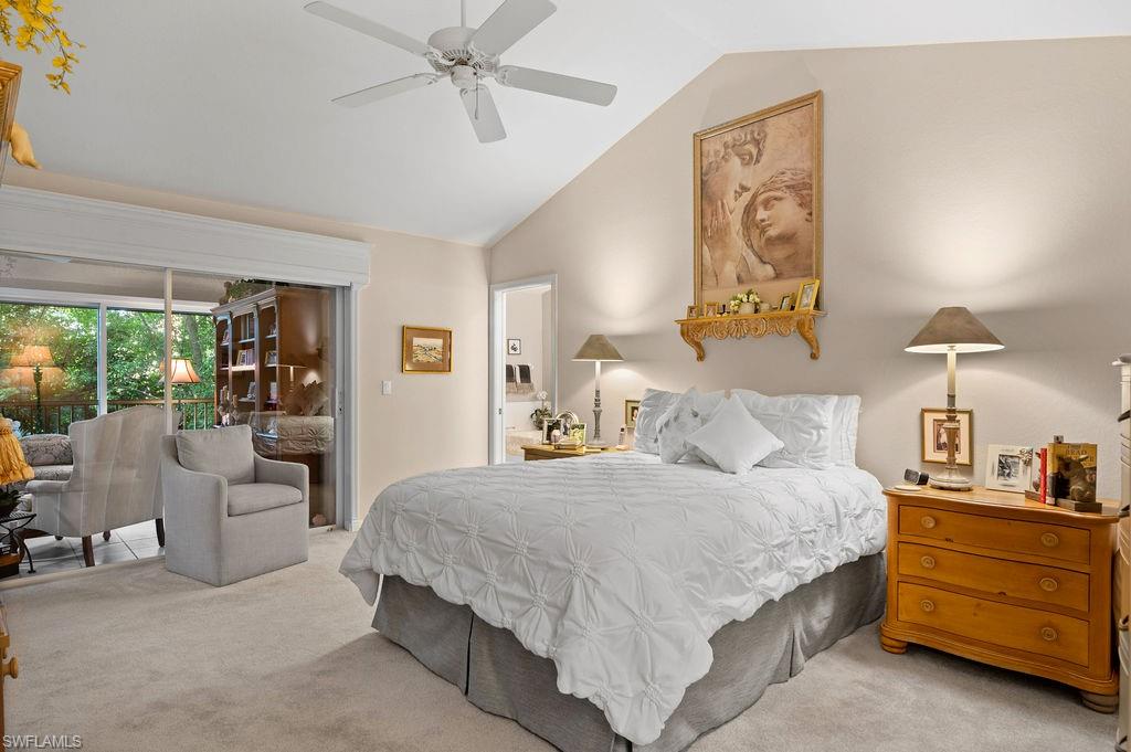 205 Via Perignon, Unit 23 Naples, FL 34119 - Photo 19 of 37 a bedroom with a bed and a large window