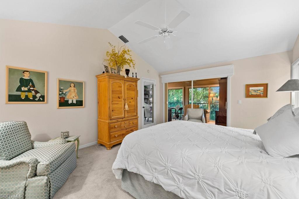 205 Via Perignon, Unit 23 Naples, FL 34119 - Photo 21 of 37 a bedroom with a bed mirror and a window