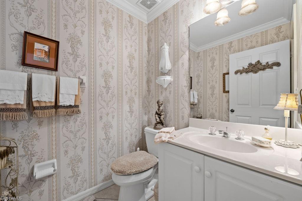 205 Via Perignon, Unit 23 Naples, FL 34119 - Photo 29 of 37 a bathroom with a sink toilet and shower