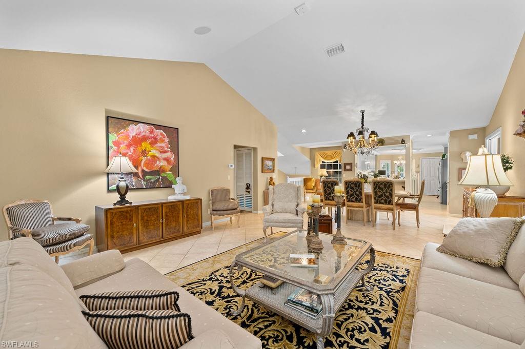 205 Via Perignon, Unit 23 Naples, FL 34119 - Photo 10 of 37 a living room with furniture and wooden floor