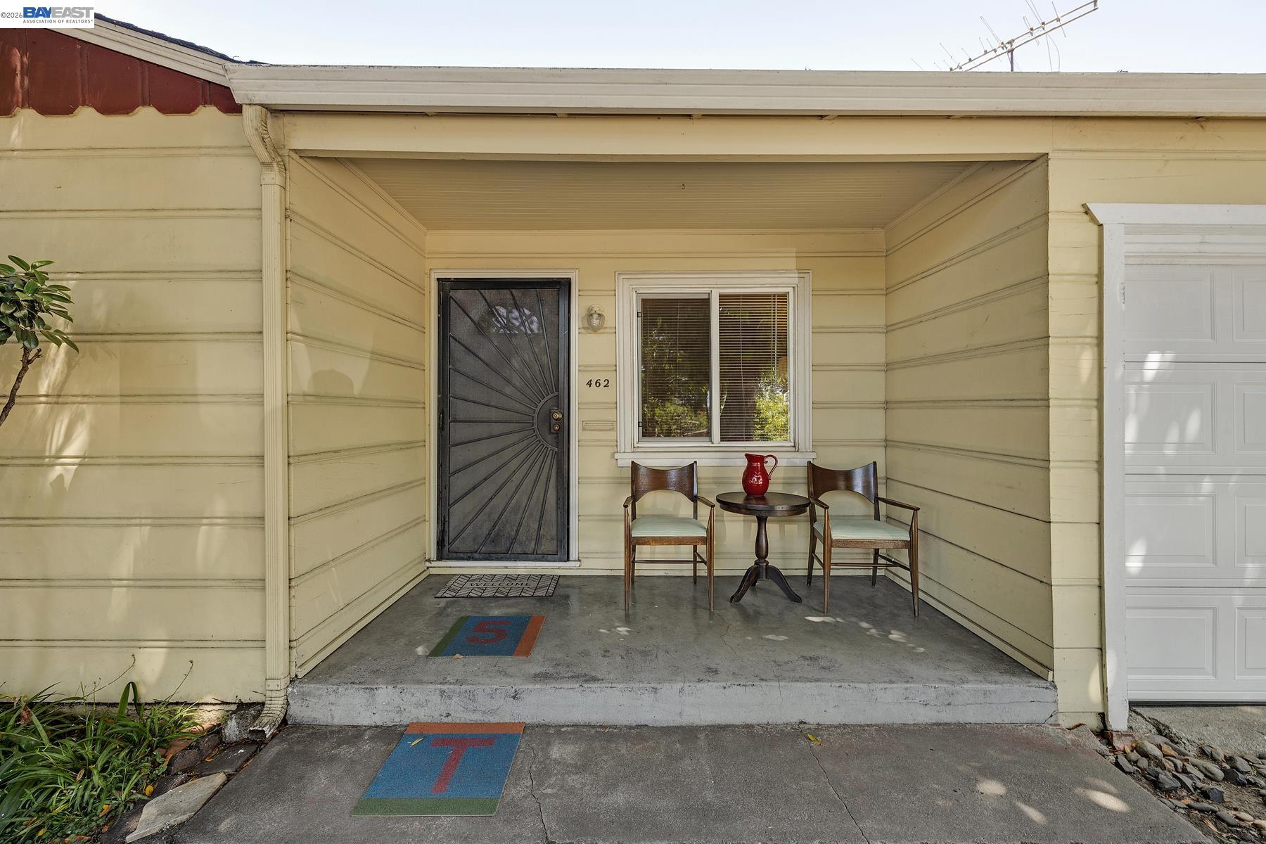 462 Hampton Road Hayward, CA 94541 - Photo 11 of 38 a bench sitting in front of a door