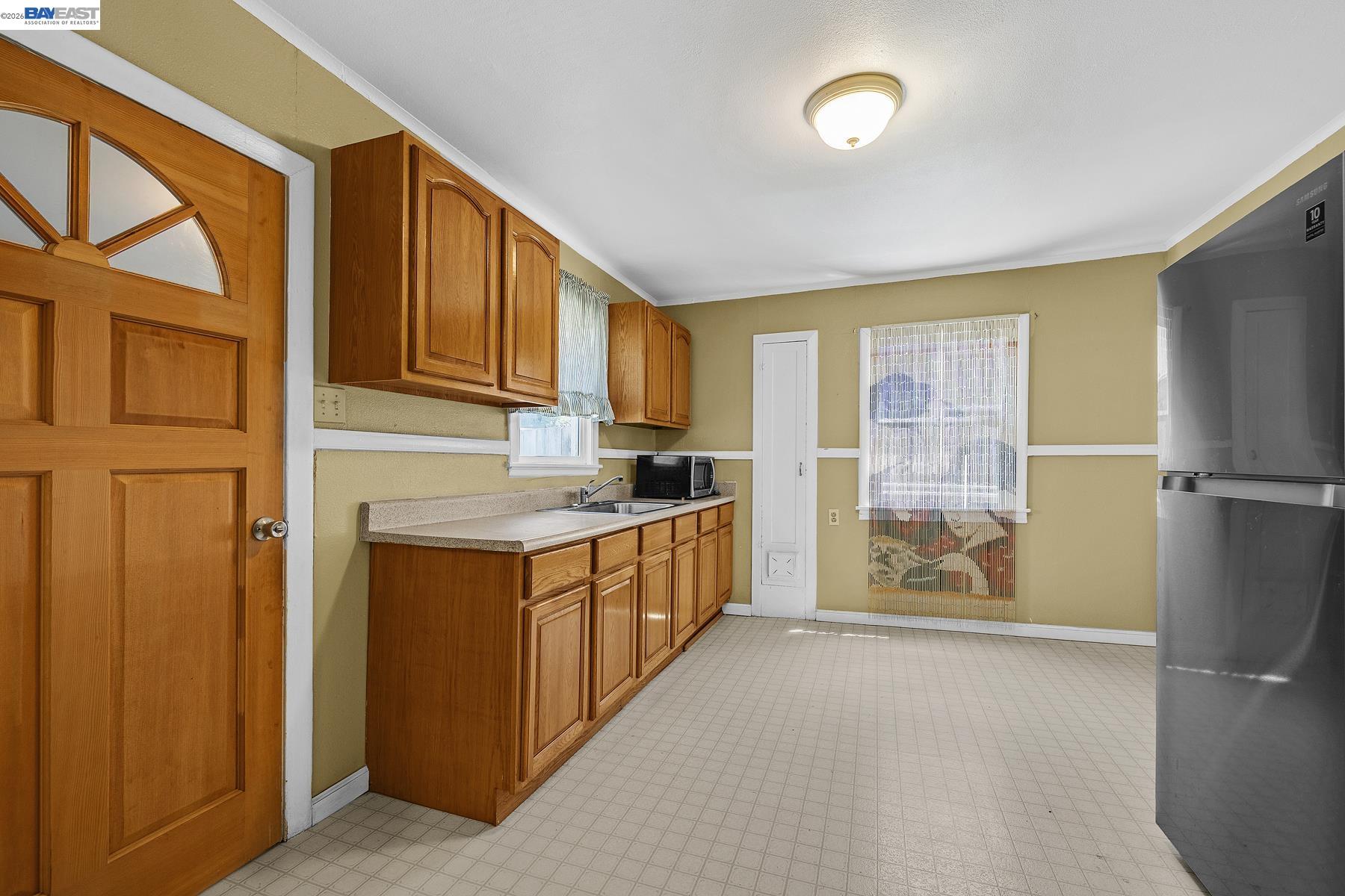 462 Hampton Road Hayward, CA 94541 - Photo 18 of 38 a kitchen with stainless steel appliances granite countertop a refrigerator a stove top oven a sink and dishwasher