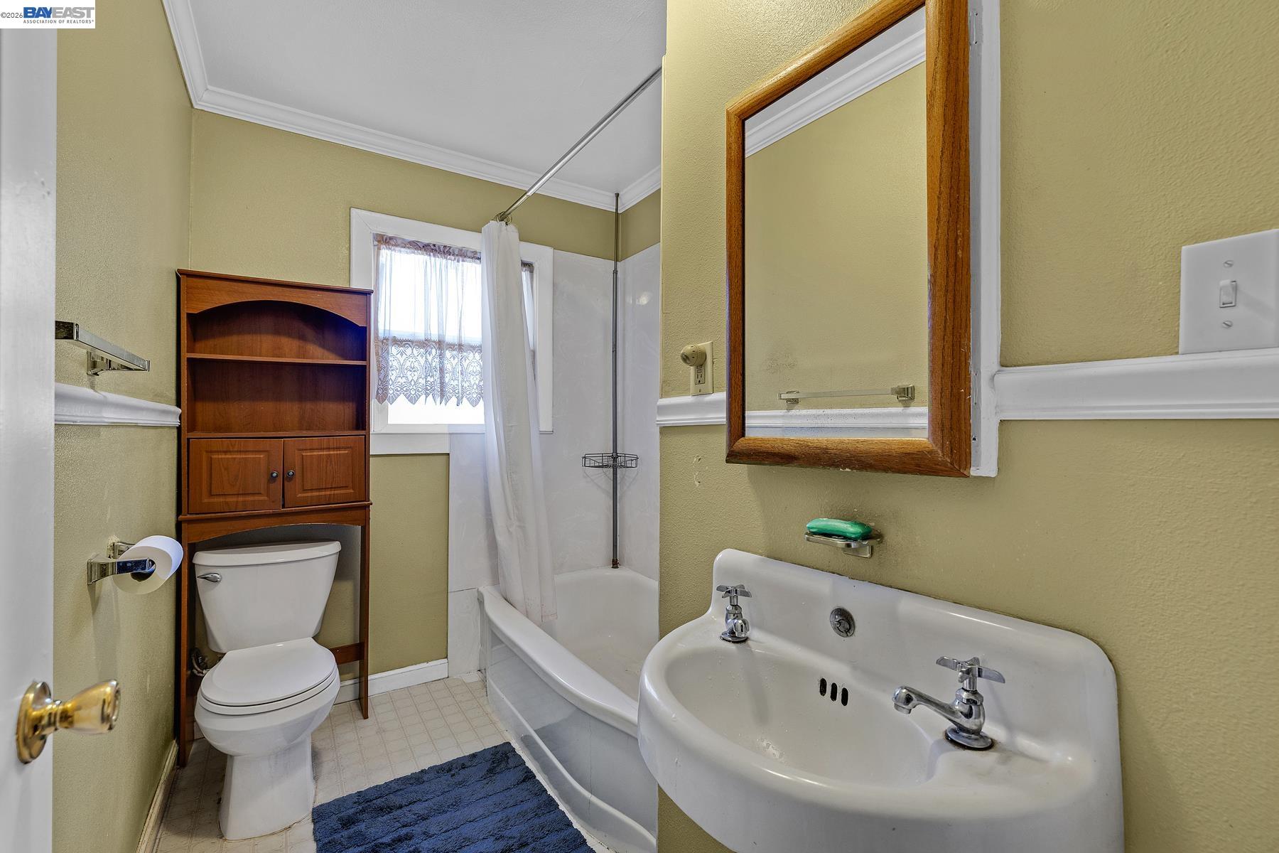 462 Hampton Road Hayward, CA 94541 - Photo 26 of 38 a bathroom with a sink a toilet and shower
