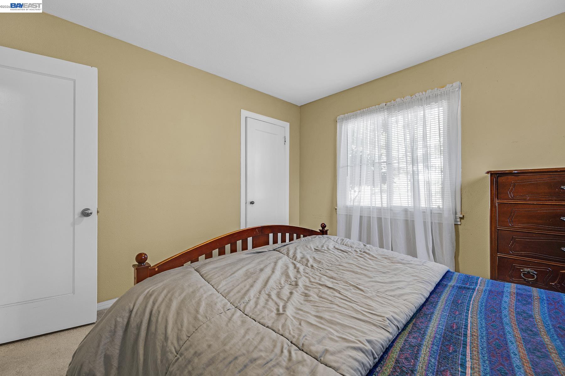 462 Hampton Road Hayward, CA 94541 - Photo 28 of 38 a bedroom with a bed and wooden floor