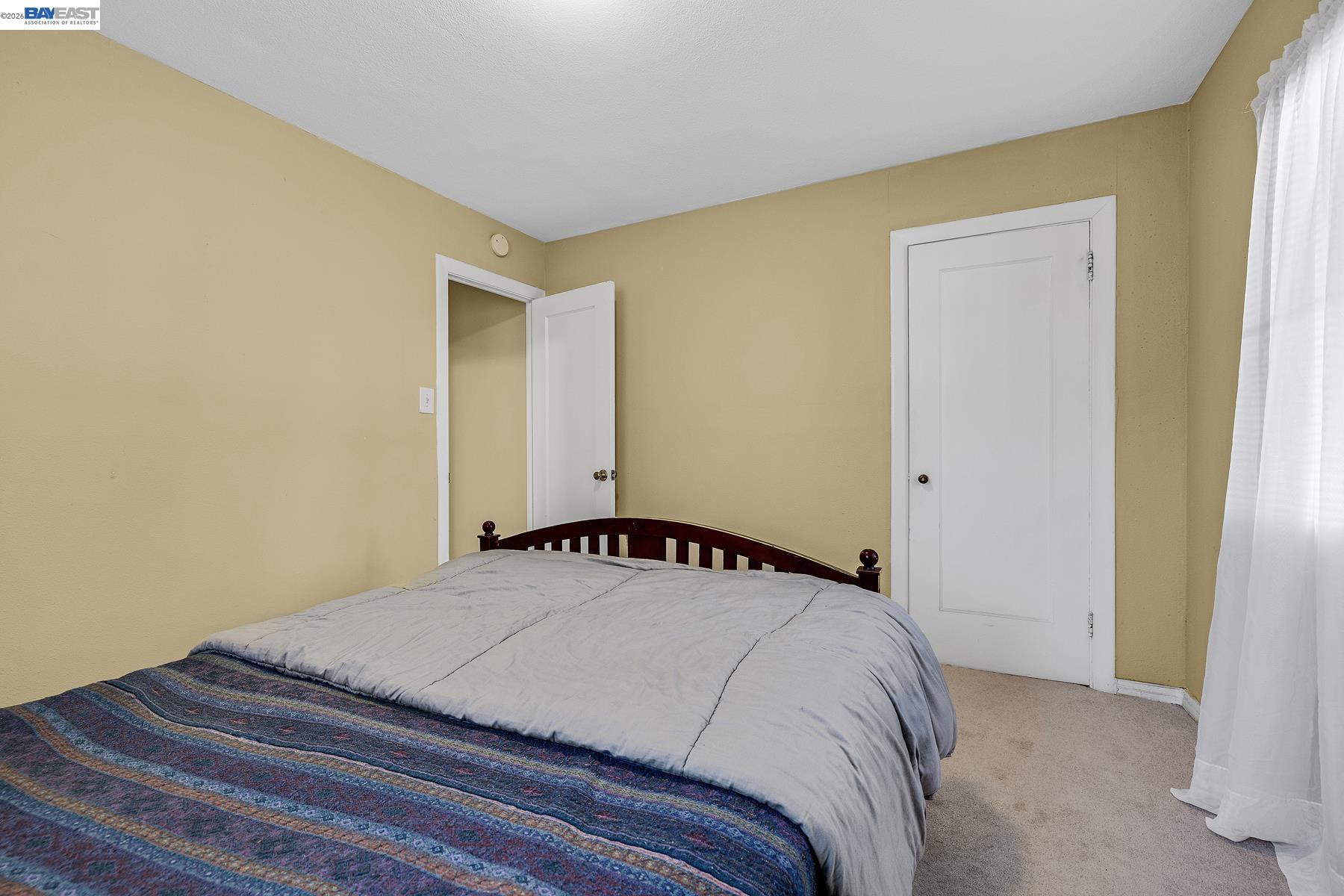 462 Hampton Road Hayward, CA 94541 - Photo 29 of 38 a bedroom with a bed and a window