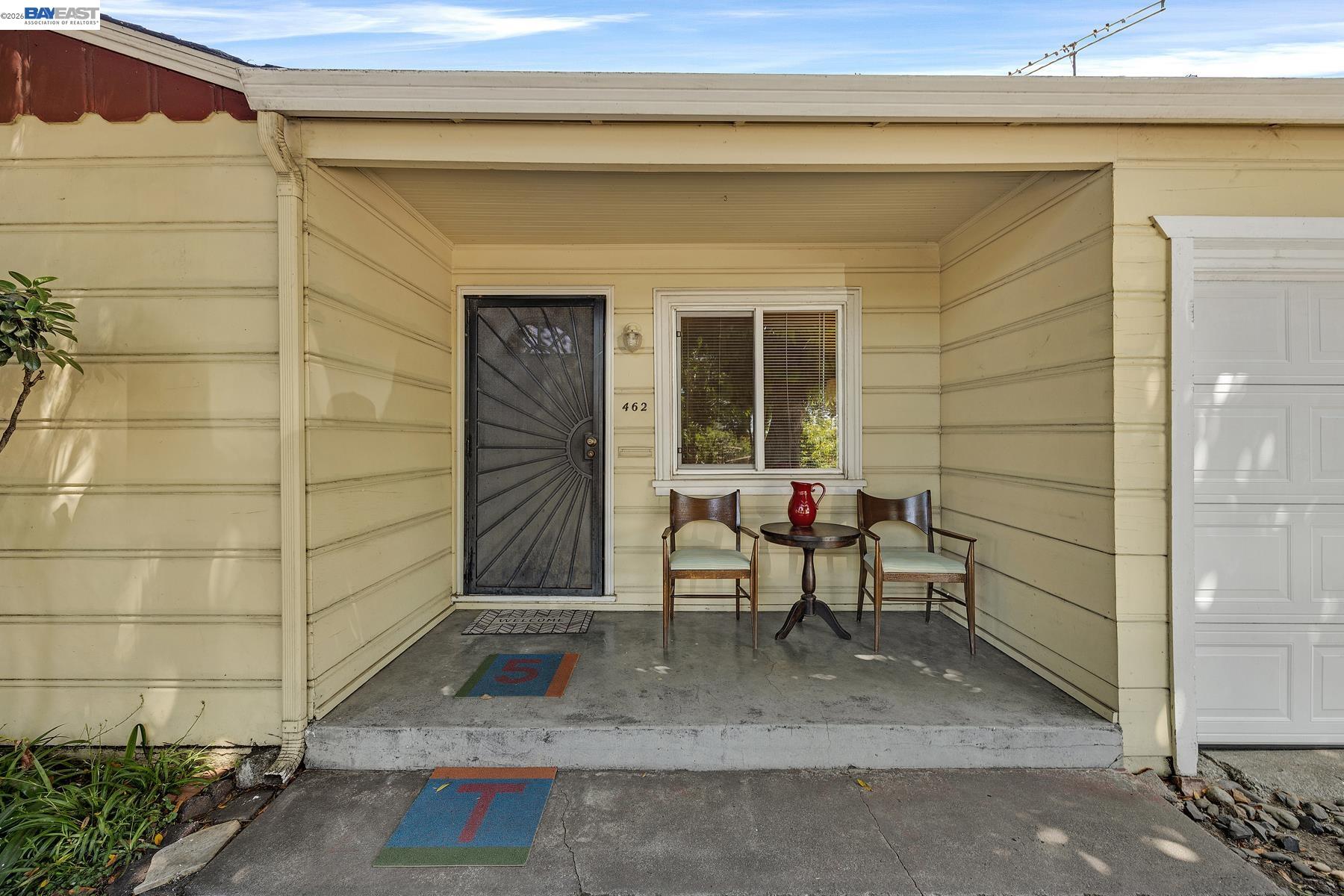 462 Hampton Road Hayward, CA 94541 - Photo 10 of 38 a bench sitting in front of a door
