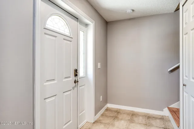 a view of a livingroom with wooden floor and closet