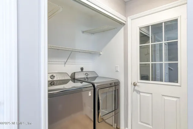 a utility room with dryer and washer