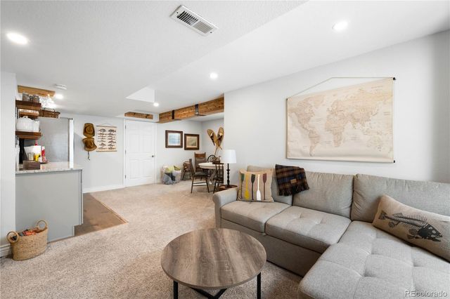 a kitchen with stainless steel appliances a refrigerator and cabinets