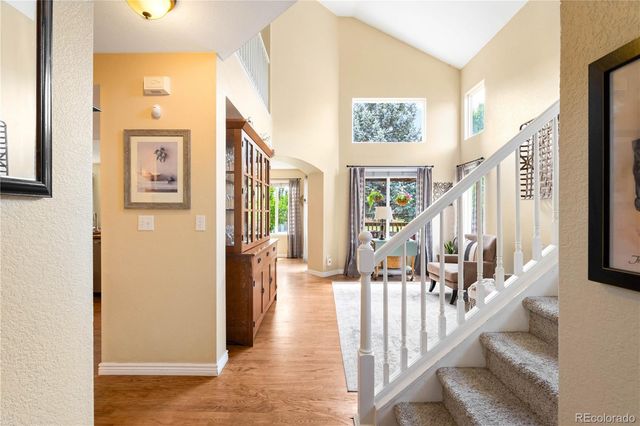 a view of an entryway with wooden floor