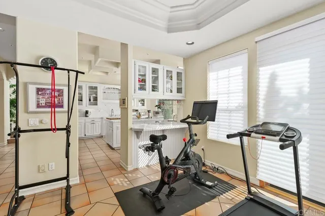 a view of a livingroom with workspace and a window