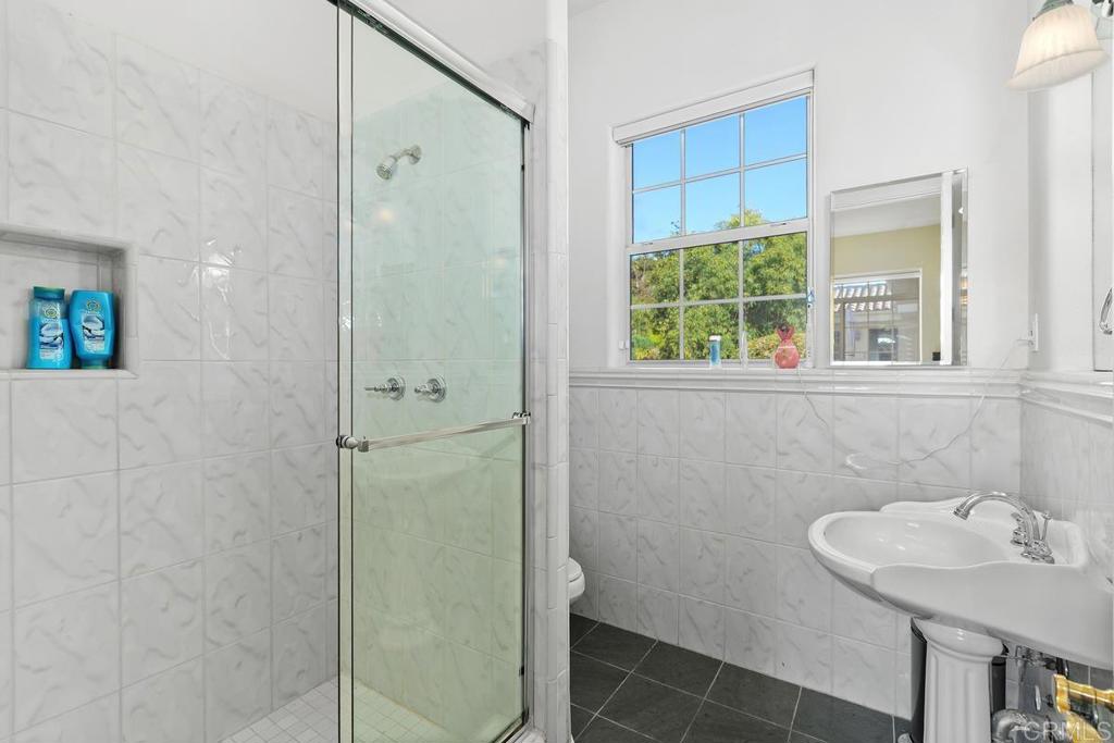 3068 Southwind Lane Vista, CA 92084 - Photo 27 of 44 a bathroom with a sink a toilet and shower