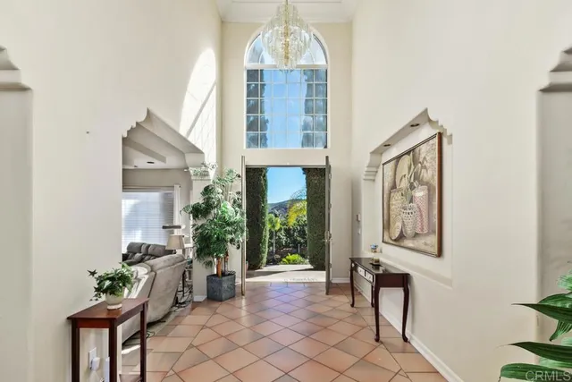 a view of a hallway with furniture and entryway